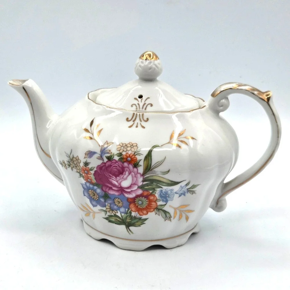 Porcelain Musical Teapot Plays 